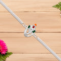 Stylish Ganesha Rakhi With Enamel Highlights And Silver Metal Chain