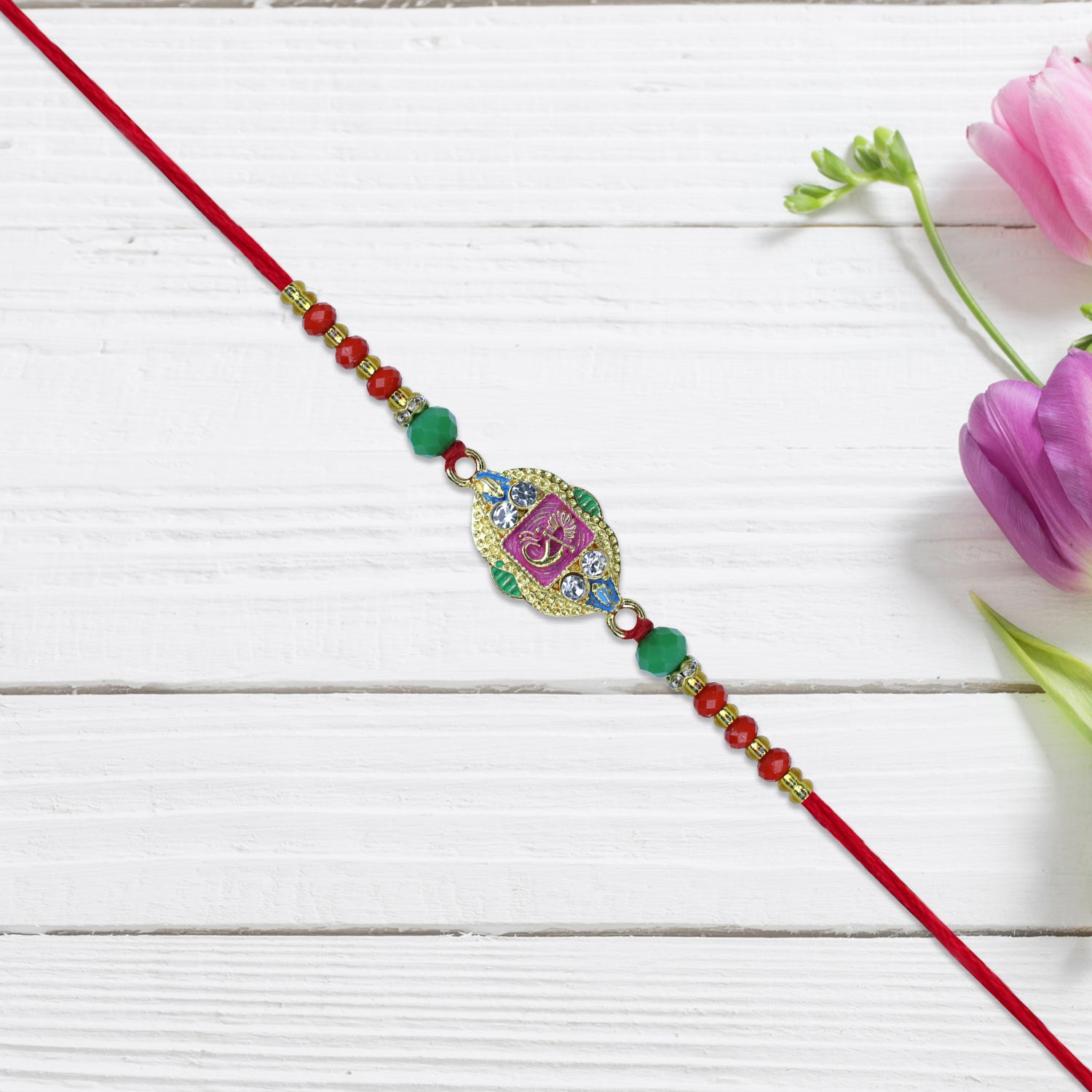 Om Rakhi With Decorative Beads And Stone Work